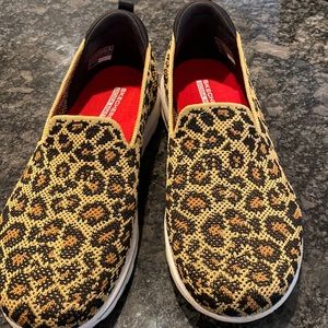 Skechers go walk slip on tennis shoes.